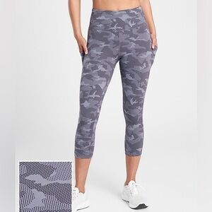 ATHLETA ULTIMATE STASH POCKET CAMO CAPRI